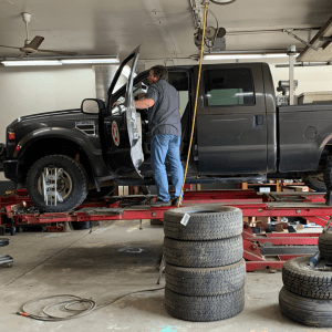 An Image of a Man Working on a Car at Four Star Supply Colfax