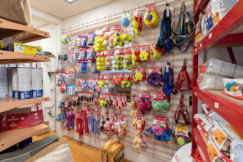 Pet Toys next to kibble for sale at Four Star Supply