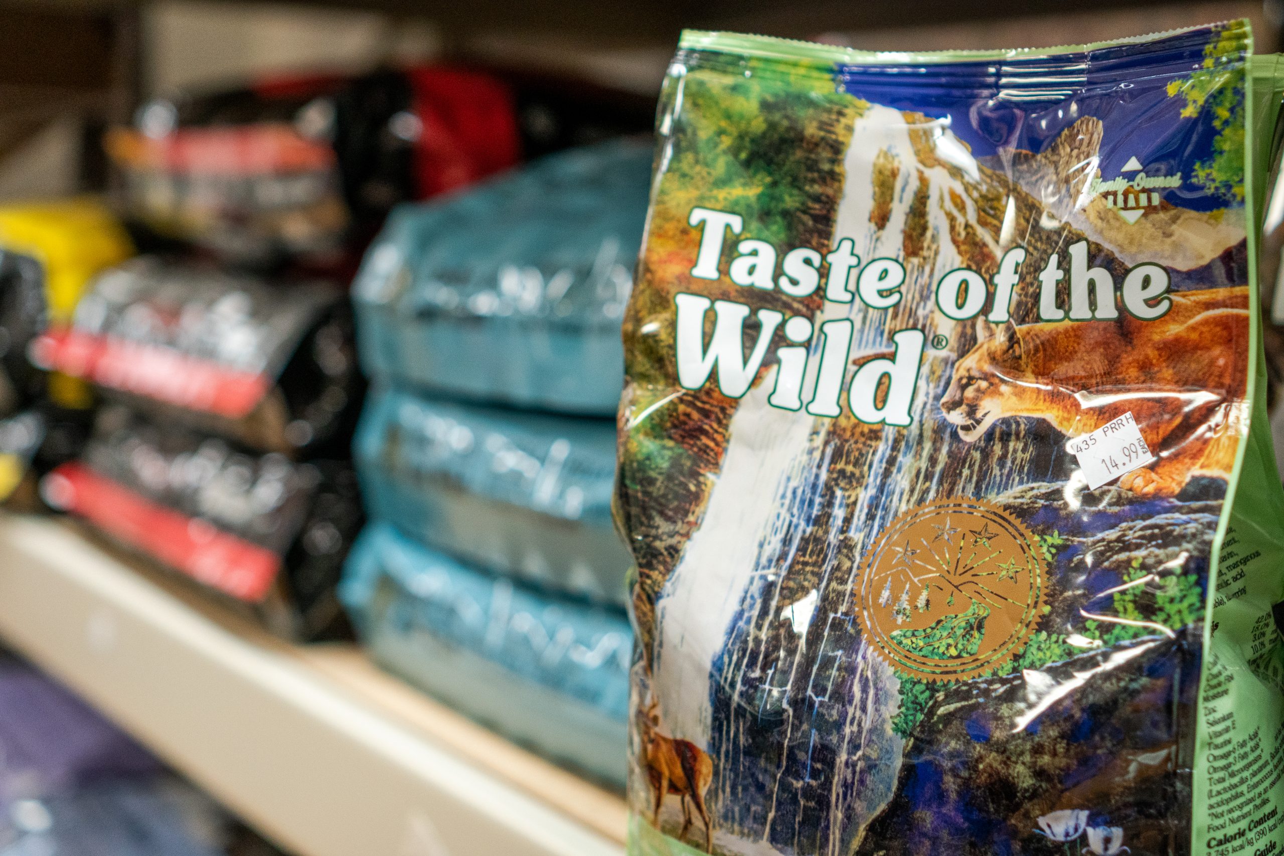 Taste of the Wild pet food next to other bags of pet food