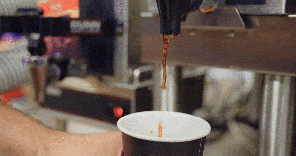 A GIF of coffee pouring into a cup at Four Star Supply