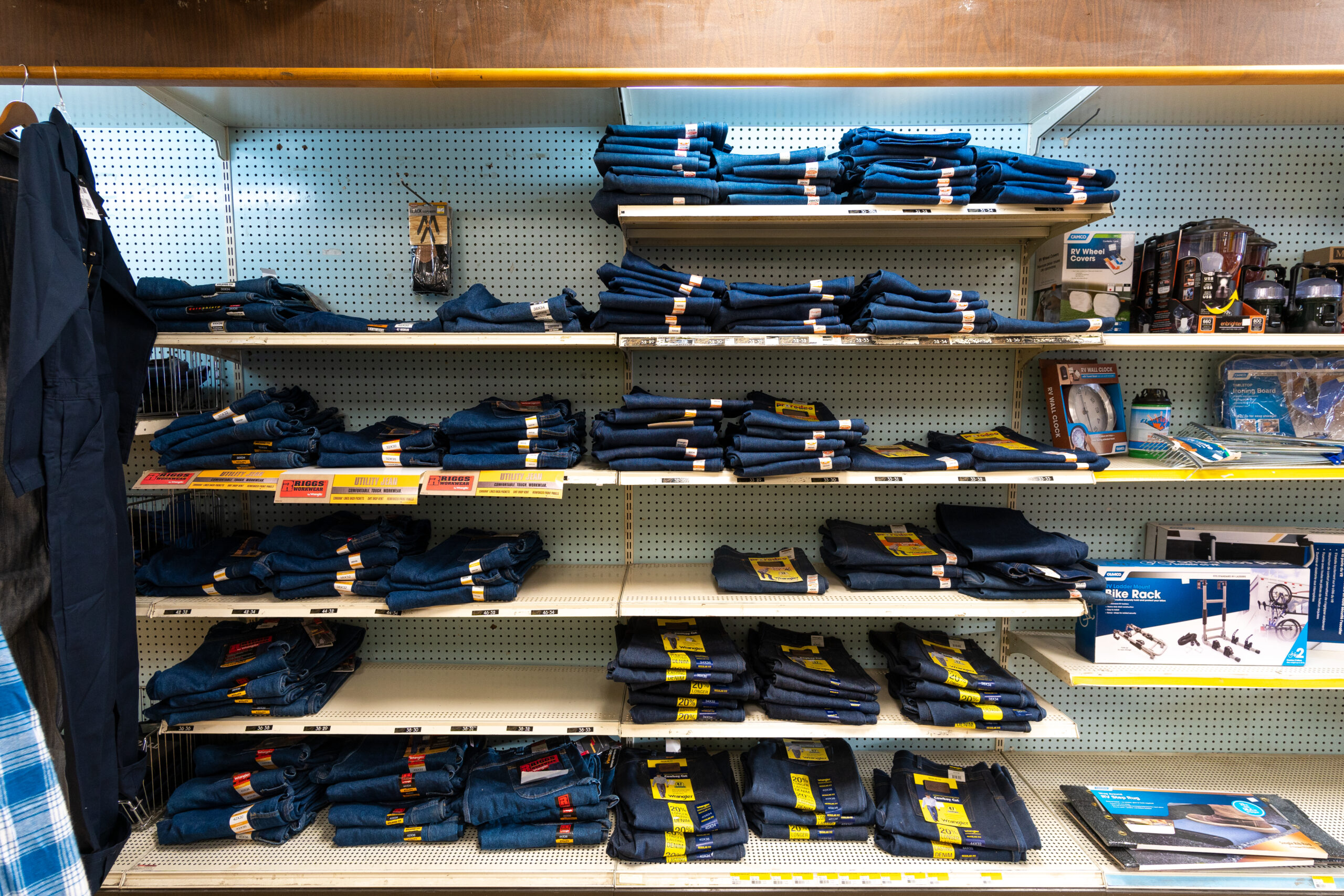 Shelves full of work jeans at Four Star Supply