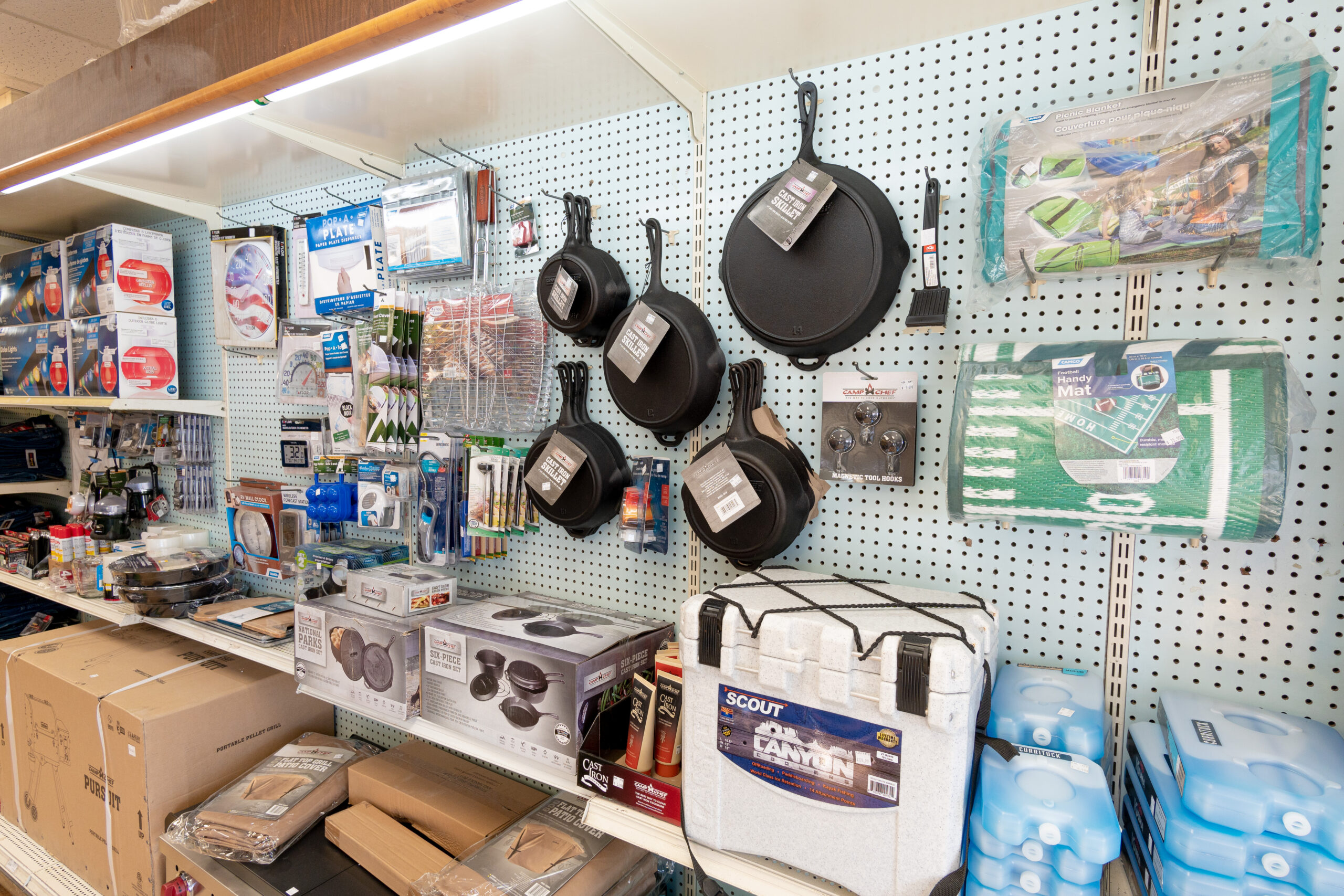Various Camping supplies, including coolers, grill accessories, & picnic blankets