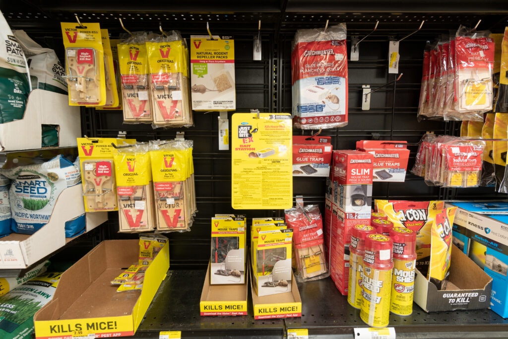 A shelf full of pest control products