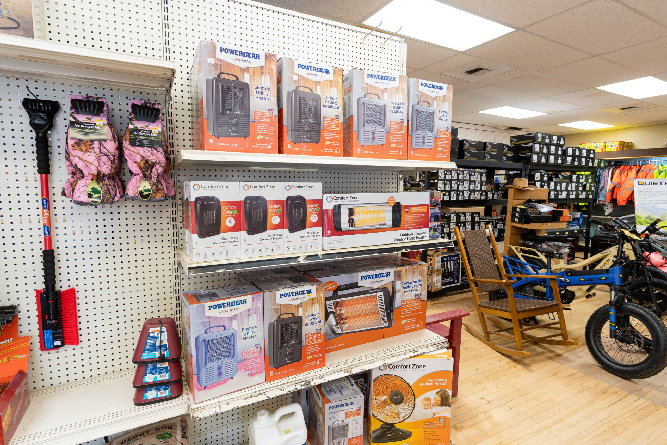 A shelf at Four Star Supply containing various products including several different kinds of heaters.