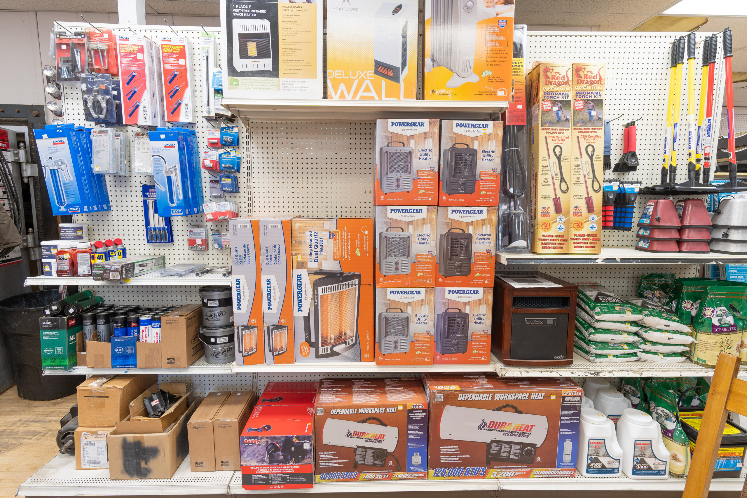A shelf at Four Star Supply containing various products including heaters.
