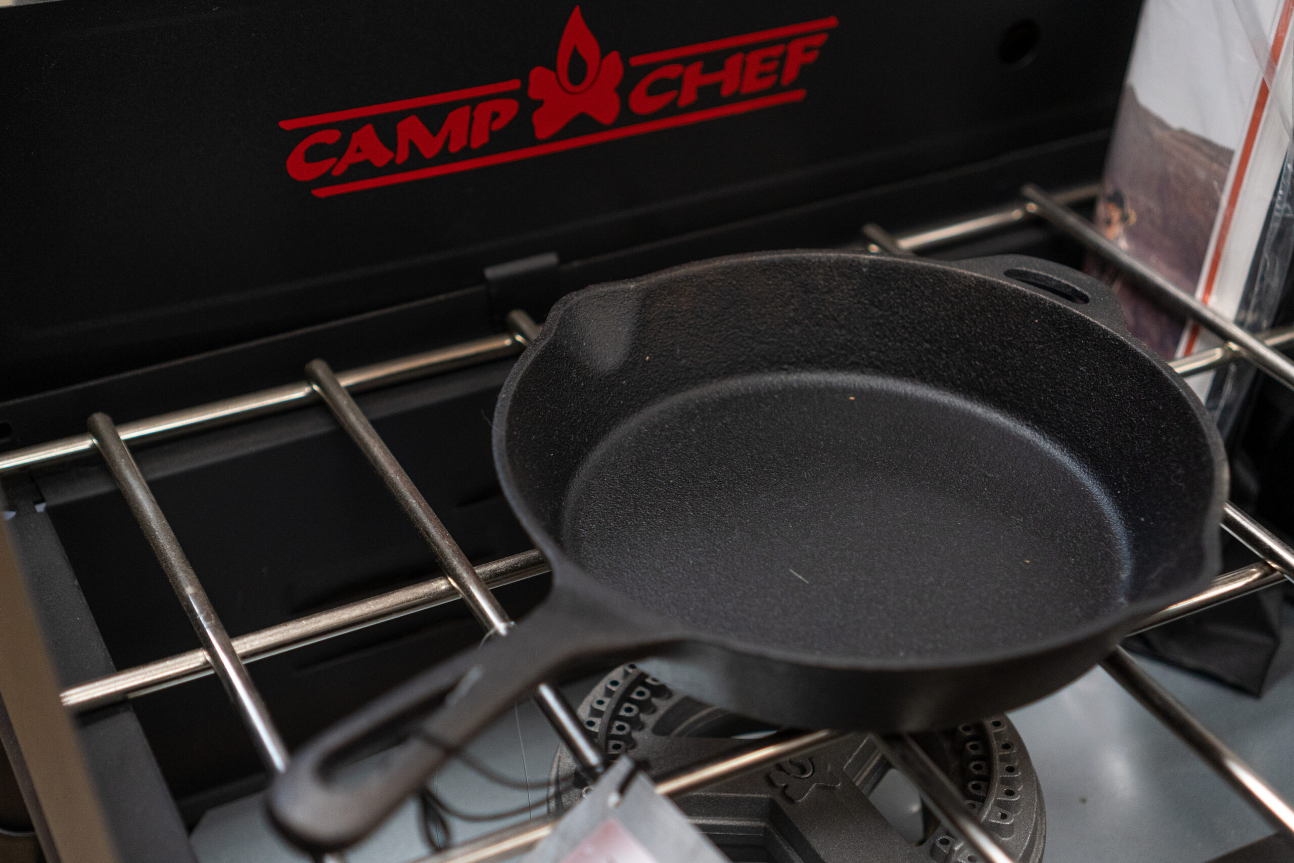 A cast iron pan on a Camp Chef grill.