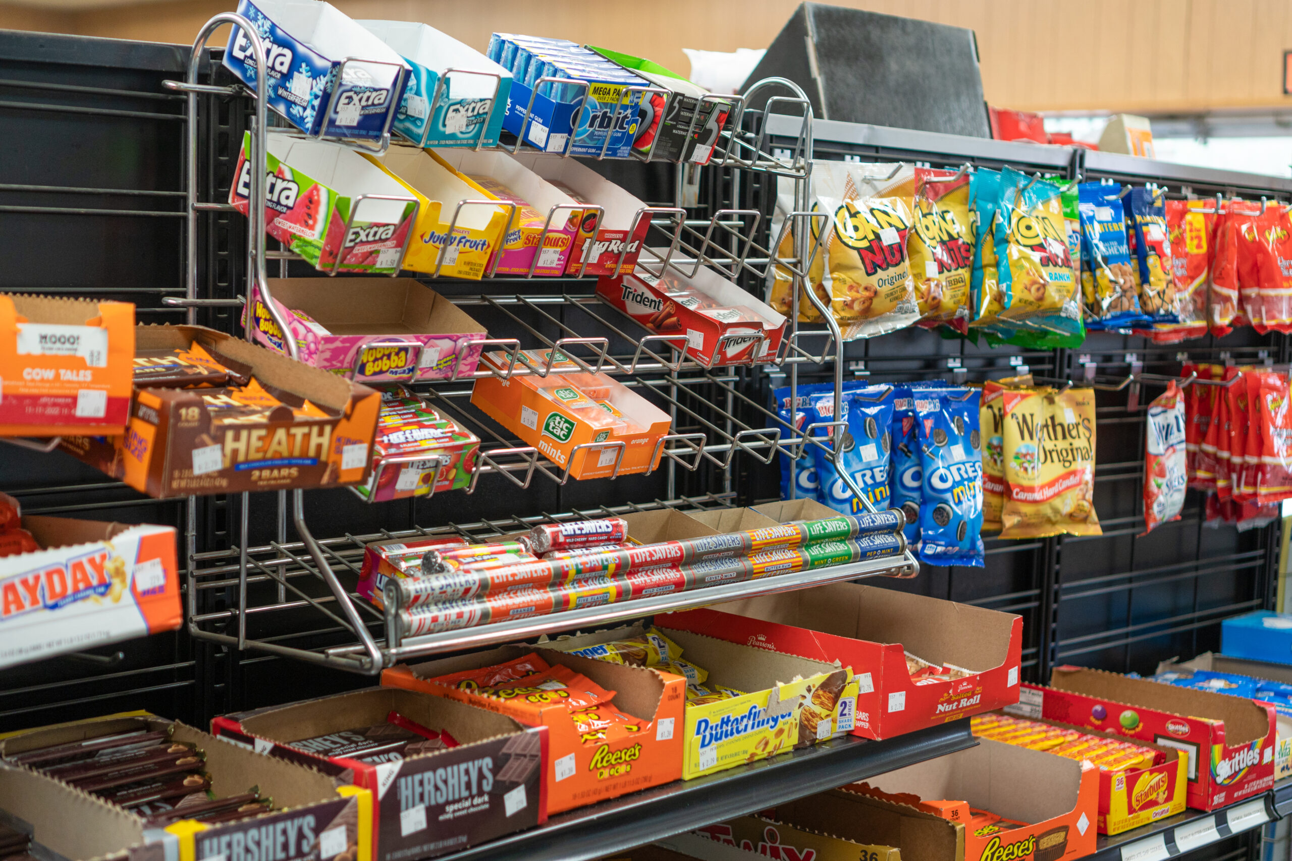 Shelves full of snacks available for sale at a Four Star Supply owned convenience store