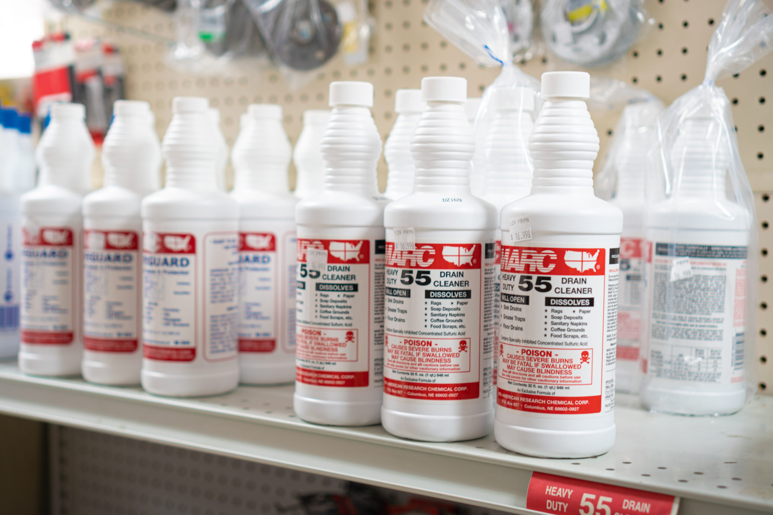 A shelf at Four Star Supply displaying MARC brand cleaners.