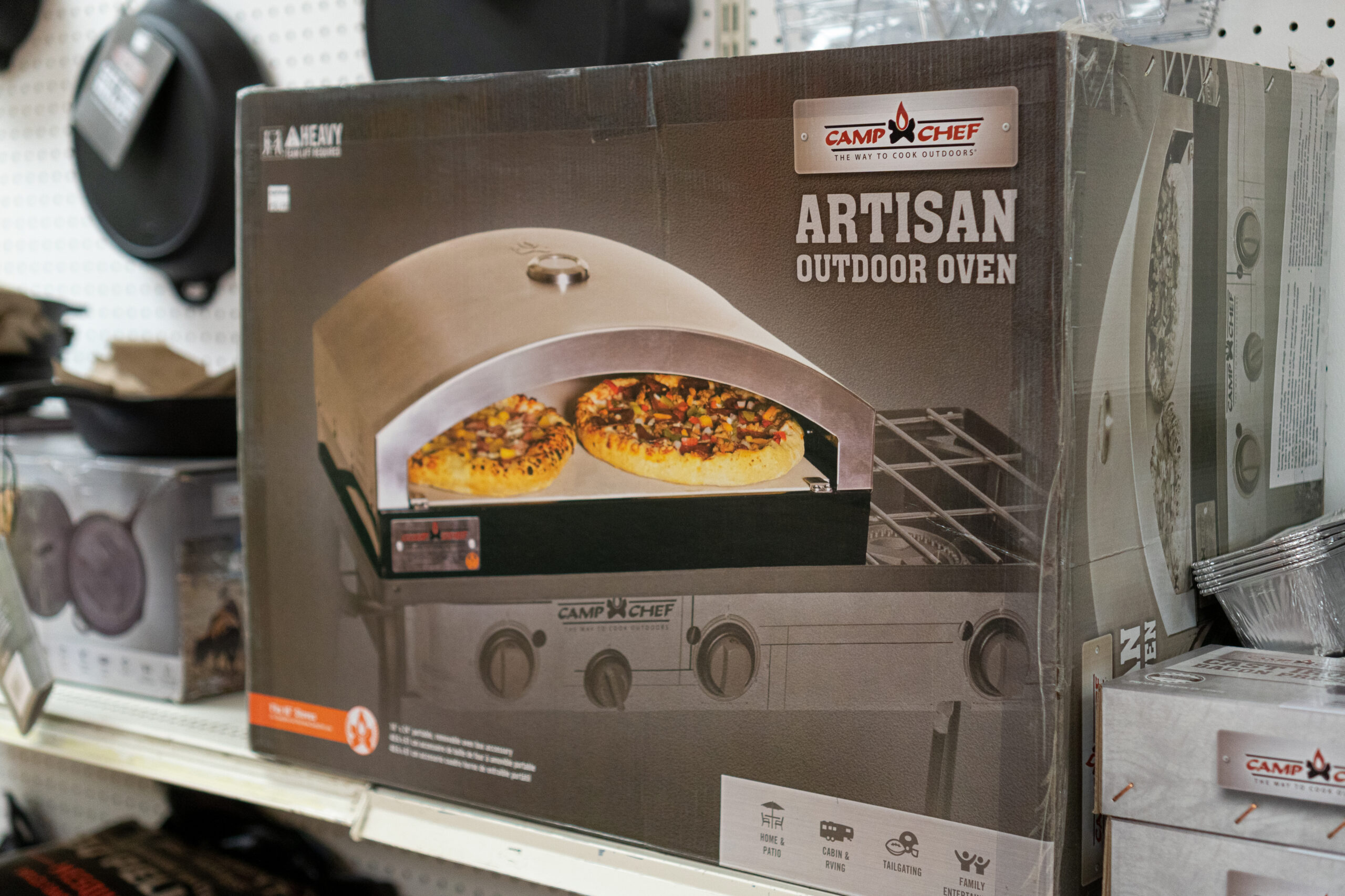 An outdoor oven grill attachment from the Camp Chef brand.