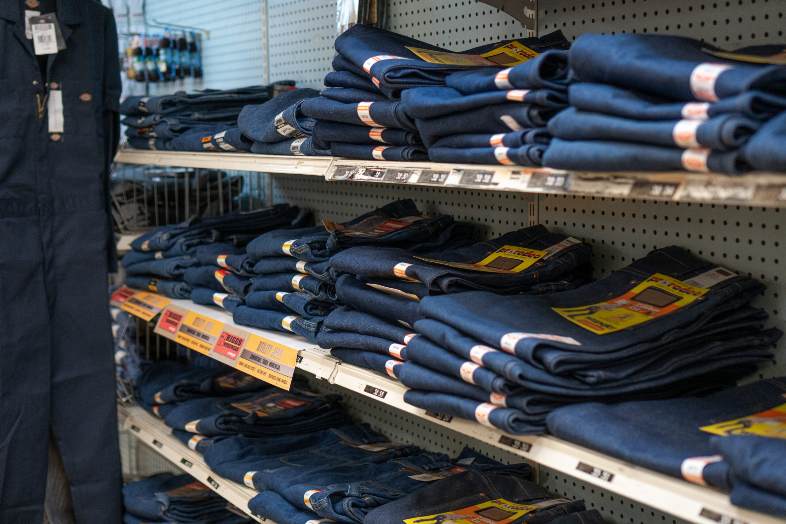 Shelves full of work jeans from Wrangler & Utility Jeans