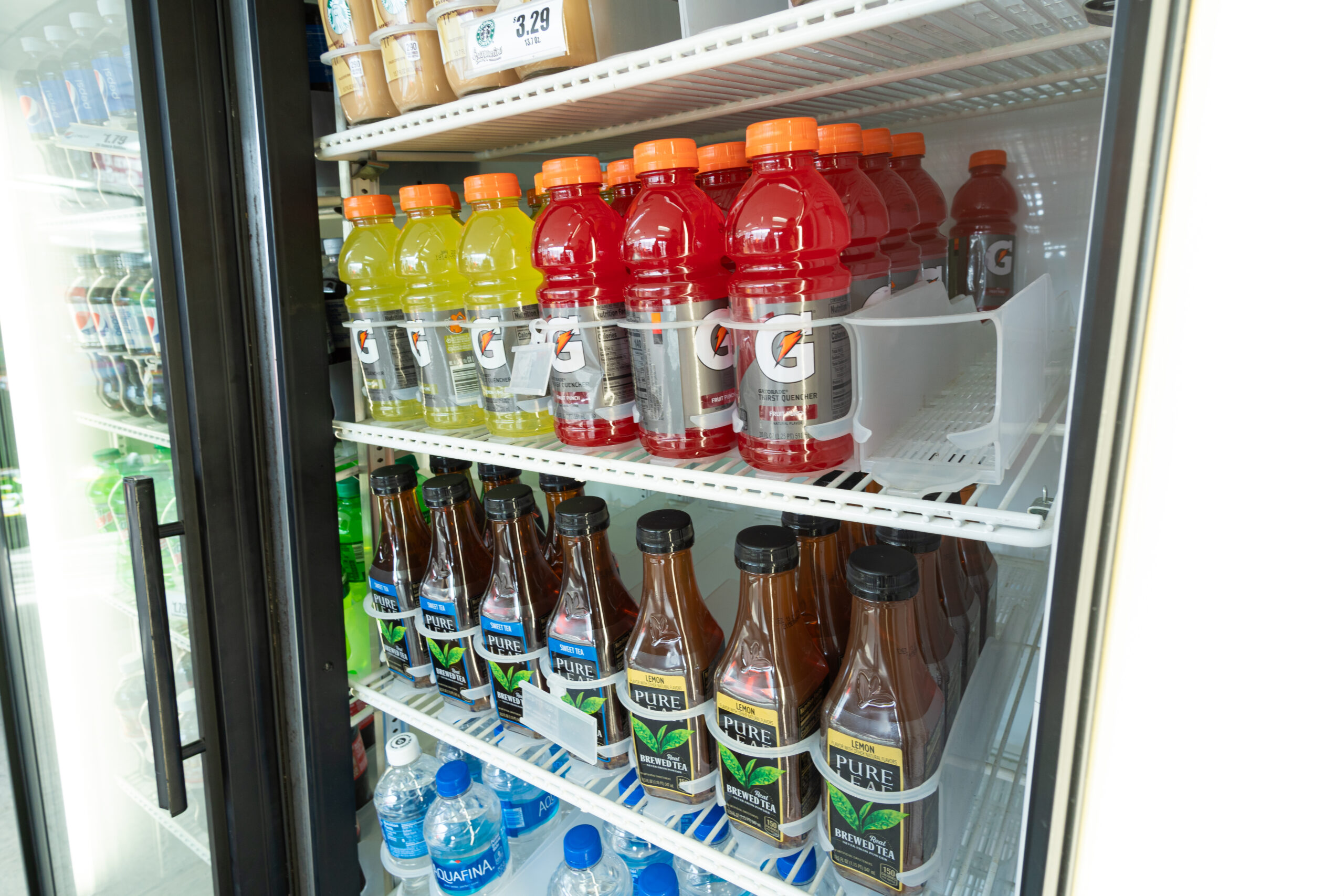 Gatorade sitting in a convenience store refrigerator
