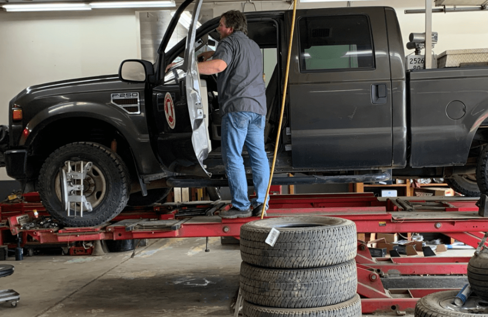 An Image of a Man Working on a Car at Four Star Supply Colfax