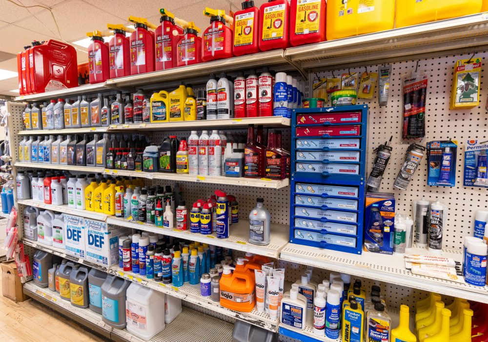 A shelf at Four Star containing brands like Rain X, Little Trees, & CRC