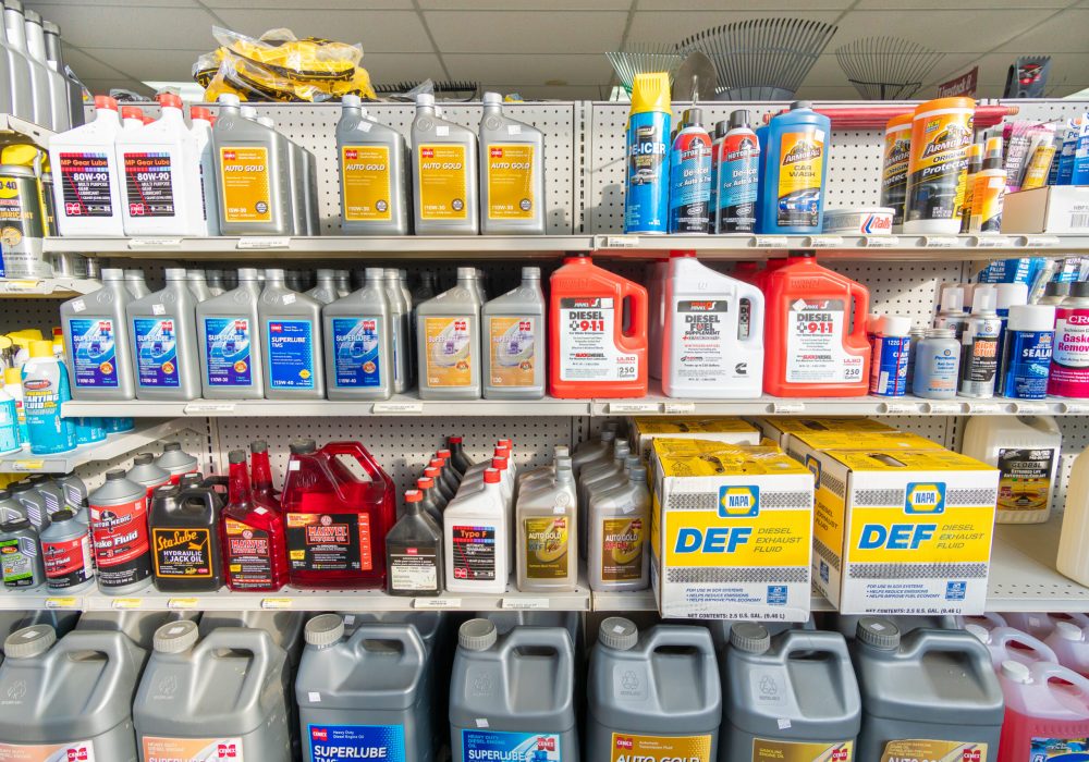 A shelf at Four Star Supply holding products by Cenex, Power Service, Armor-All, Motor Medic, & others such as De-Icer, ATF, & Engine Oil