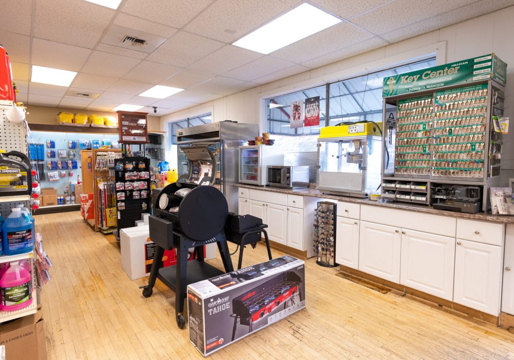A grill standing amidst shelves of other products at the Pullman Four Star Supply