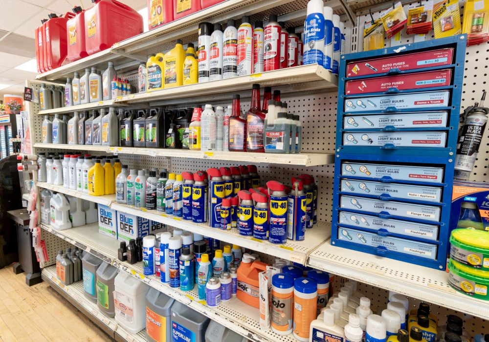 A shelf at Four Star containing brands like WD-40, Gum Out, Prestone, and Cenex