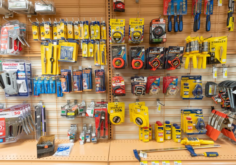 Tools like tape measures, wrenches, staple guns, and clamps.