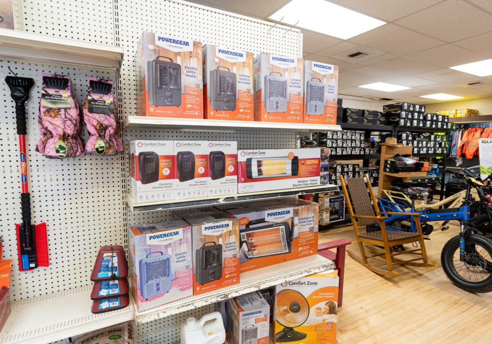 A shelf at Four Star Supply containing various products including several different kinds of heaters.