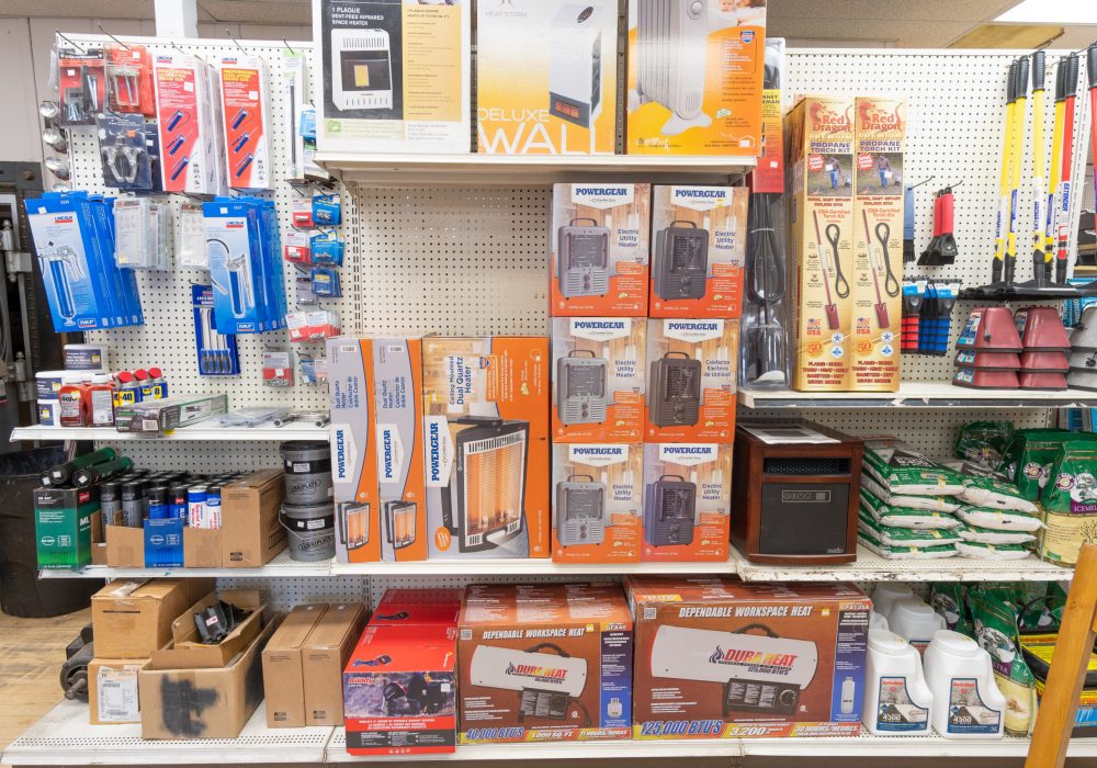 A shelf at Four Star Supply containing various products including heaters.