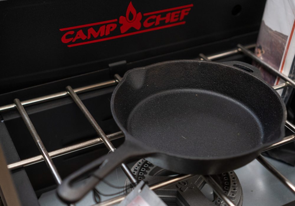 A cast iron pan on a Camp Chef grill.