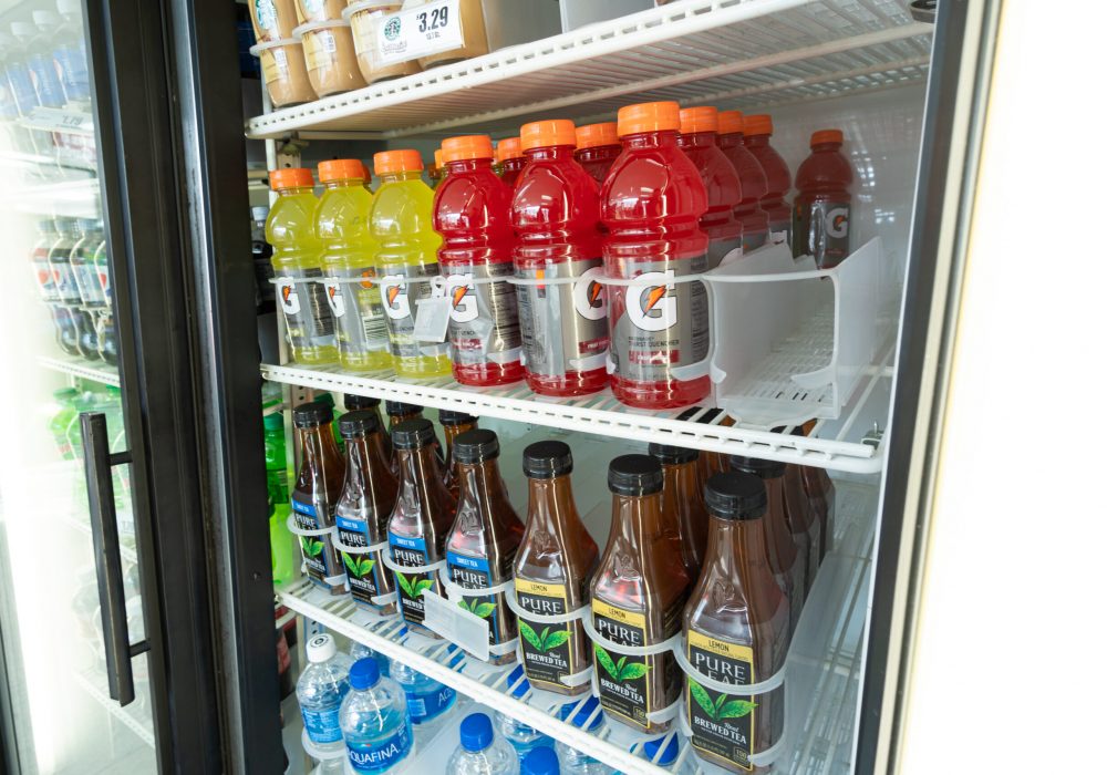 Gatorade sitting in a convenience store refrigerator